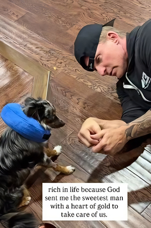 Steve feeds their sickly pup Wyatt some treats - @themoneymichelle - Instagram